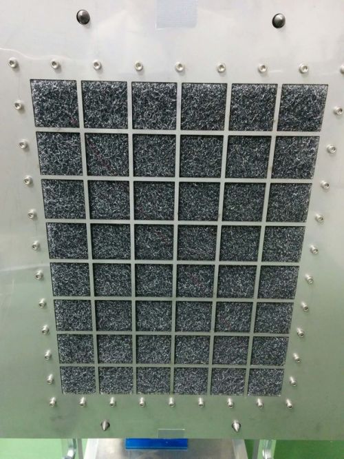 Downstream side of flat sheet media after exposure to ASHRAE 52.2 loading dust